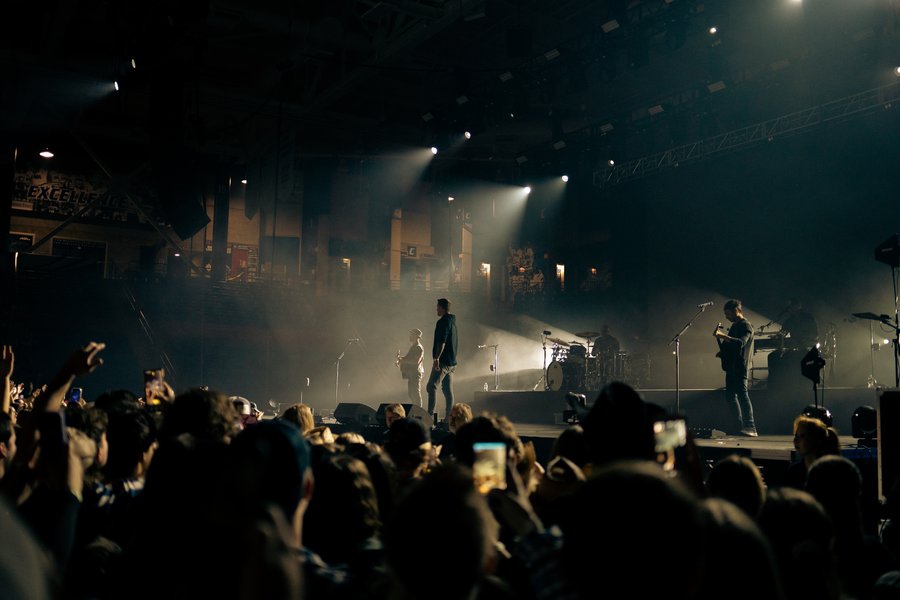 Brett Young and band silhouetted on stage, Durham, NH