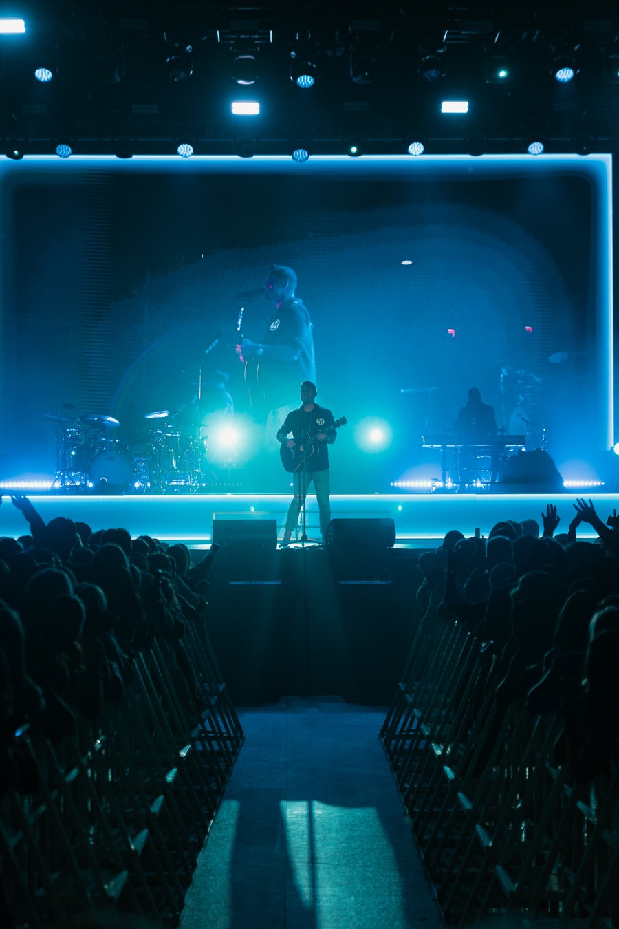 Brett Young performing under blue stage light, Durham, NH