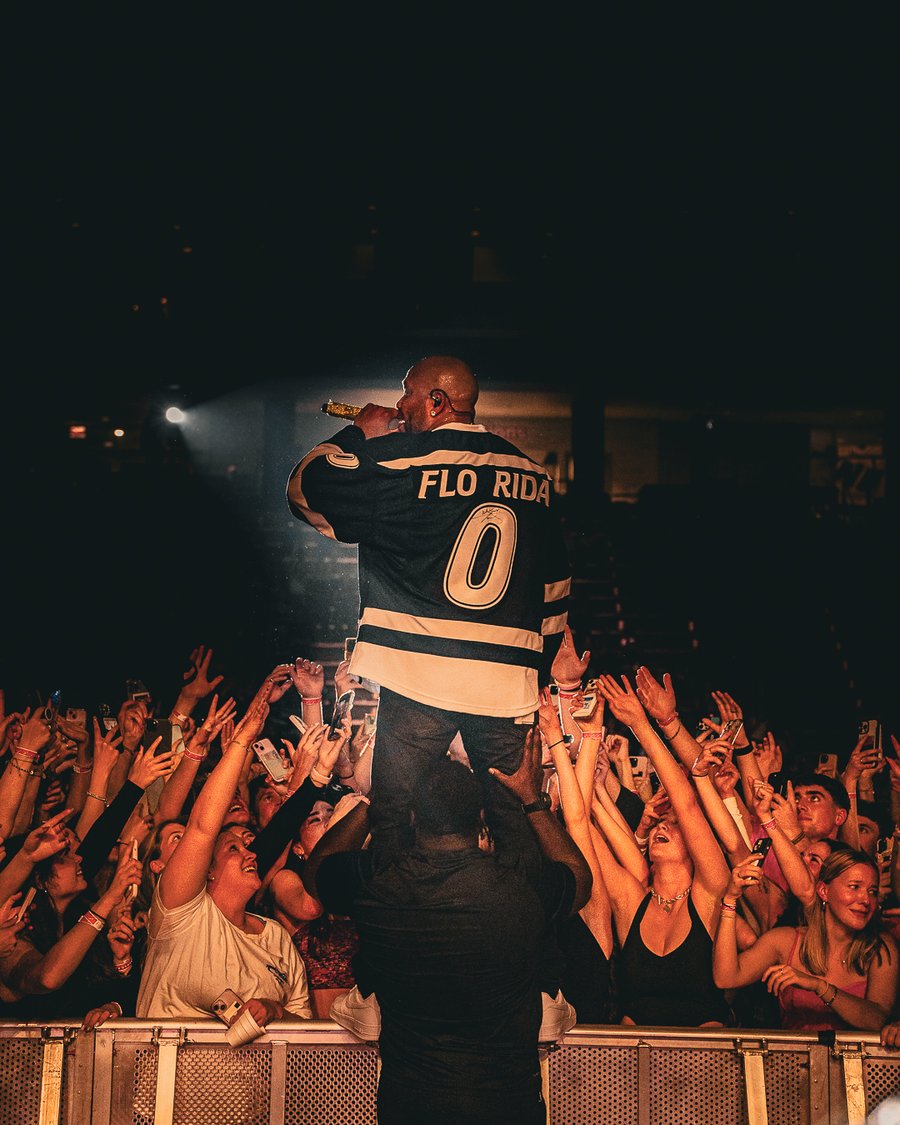 Flo Rida in a Flo Rida jersey above the crowd, Durham, NH