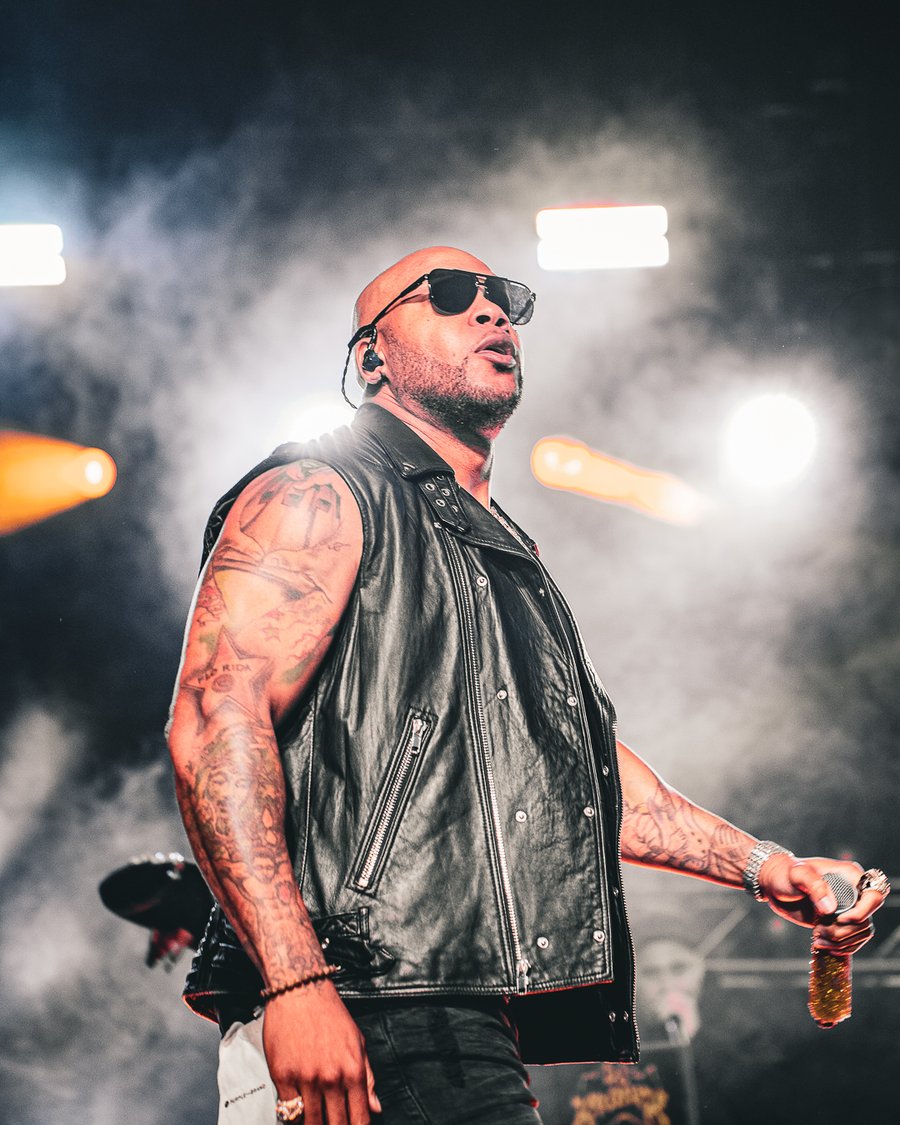 Flo Rida on stage in a leather vest, Durham, NH