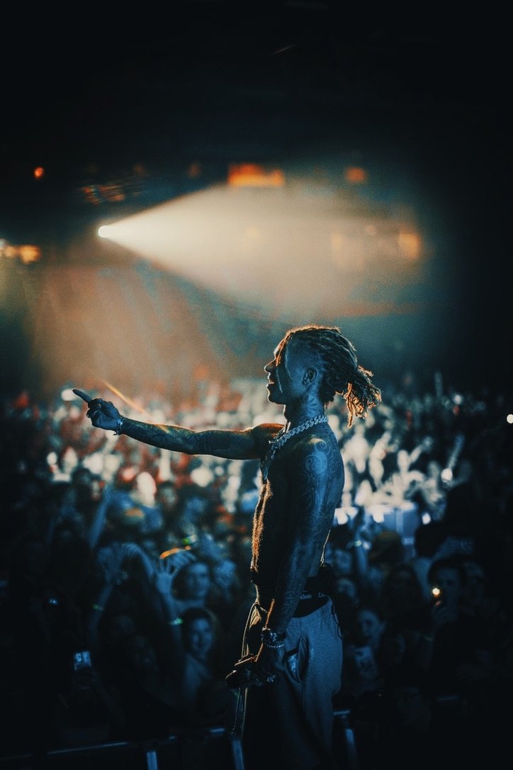 Rae Sremmurd member silhouetted against the crowd, Durham, NH