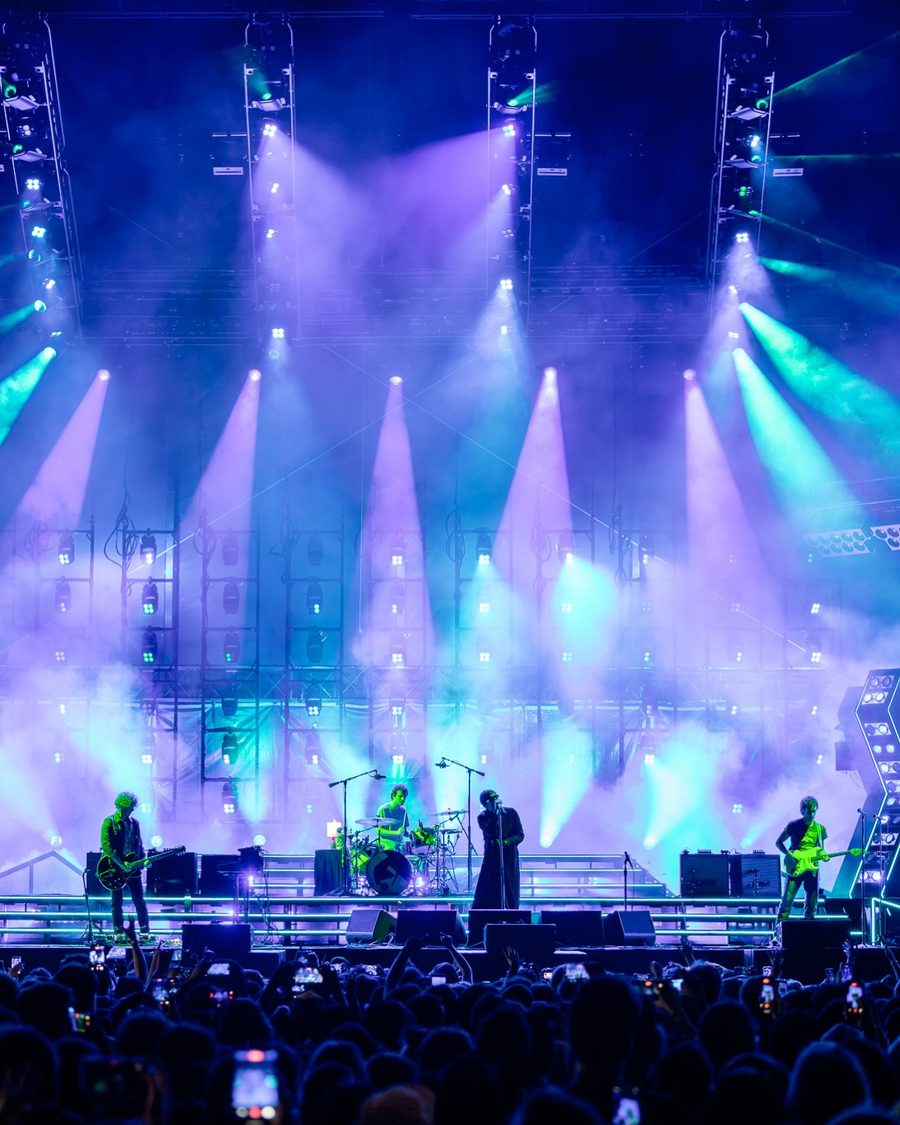 The Strokes performing on stage under purple and teal lights, Flushing Meadows Corona Park, Flushing, NY